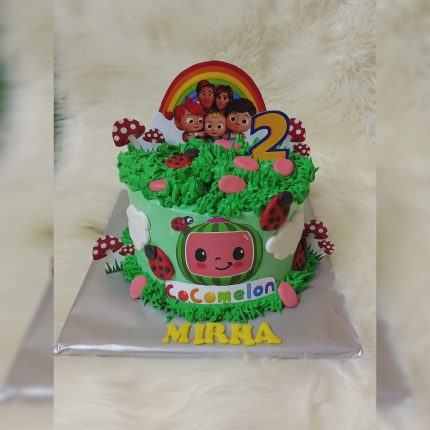 Cocomelon Adventure Cake with characters and rainbow decoration for a kid's birthday in Karachi.