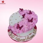 Butterflies with Flowers Cake with pink rosettes and butterflies