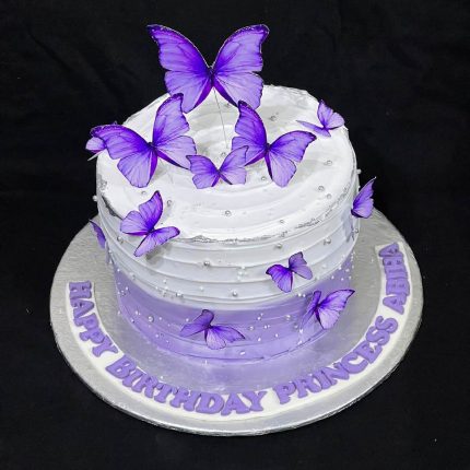 Elegant purple butterfly-themed birthday cake for Princess Aimen with layered design and butterfly toppers