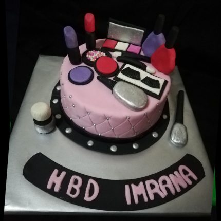 Beautiful Makeup Mix Cake in Karachi with cosmetic-themed decorations including lipsticks, brushes, and compact powders.