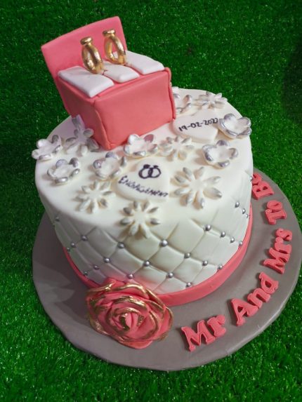 Golden Promise Engagement Ring Theme Cake with intricate floral and ring box design in Karachi.