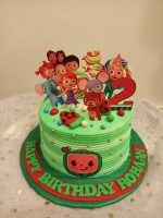 Colorful children's birthday cake with cartoon characters and a number 2 topper for Rohan's second birthday