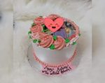 Picture-Perfect Cake in Karachi with a personalized photo and floral decorations.