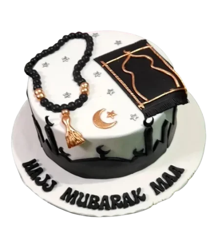 Elegant Hajj Mubarak cake with prayer beads, Kaaba design, and moon and star decorations