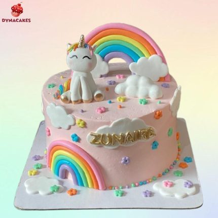 Unicorn and rainbow theme cake for baby girl birthday in Karachi with vibrant colors, unicorn topper, and fondant rainbows.