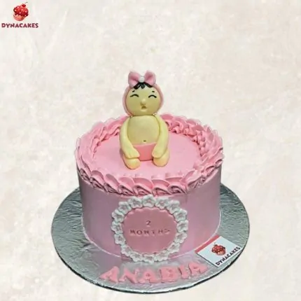 2nd-month birthday cake for baby girl in Karachi with pastel theme and personalized design by Dynacakes.