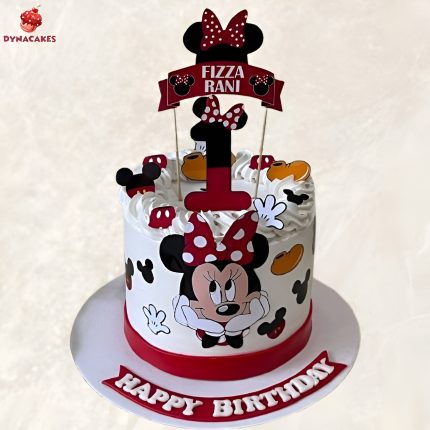 Minnie Mouse theme cake for a first birthday celebration in Karachi, featuring fondant decorations, bow, and polka dots.