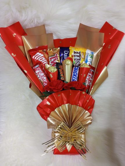 "Elegant chocolate bouquet featuring Ferrero Rocher, Dairy Milk, and KitKat, available for delivery in Karachi by Dynacakes."