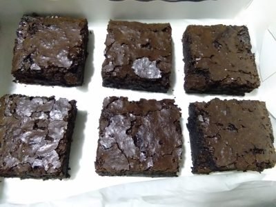 Freshly baked Chocolate Fudge Brownies with a fudgy center and crisp top, made by Dynacakes for chocolate lovers in Karachi.