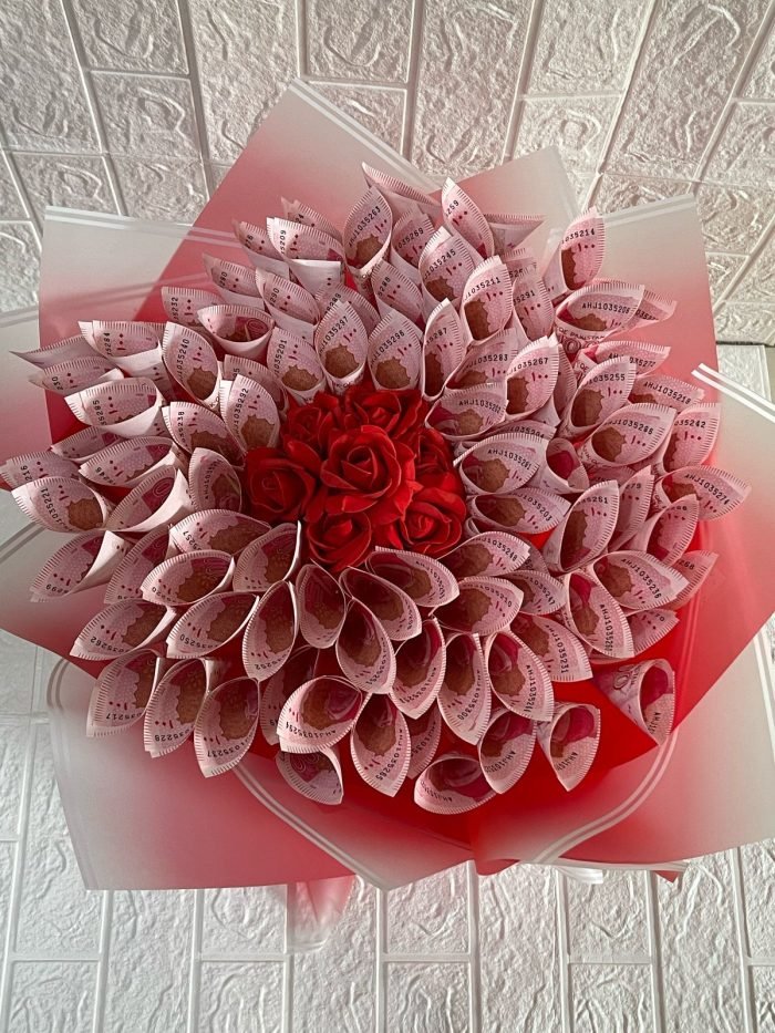 Money bouquet with folded cash notes and ribbon wrapping, perfect gift for weddings and birthdays in Karachi.