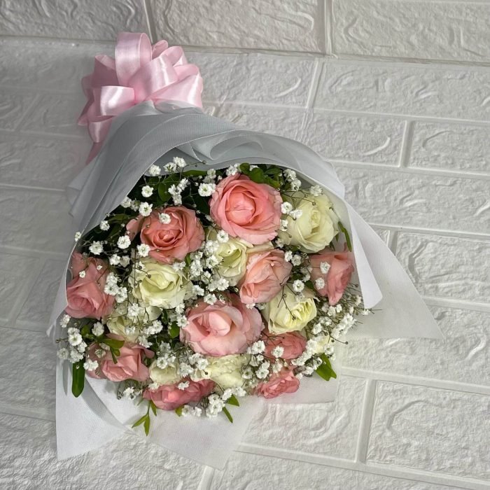 Red roses bouquet with premium wrapping for romantic gift delivery in Karachi by Dynacakes