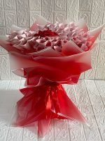 Money bouquet with folded cash notes and ribbon wrapping, perfect gift for weddings and birthdays in Karachi.