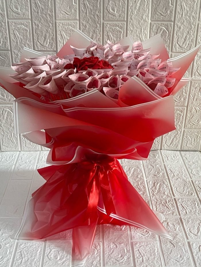 Money bouquet with folded cash notes and ribbon wrapping, perfect gift for weddings and birthdays in Karachi.