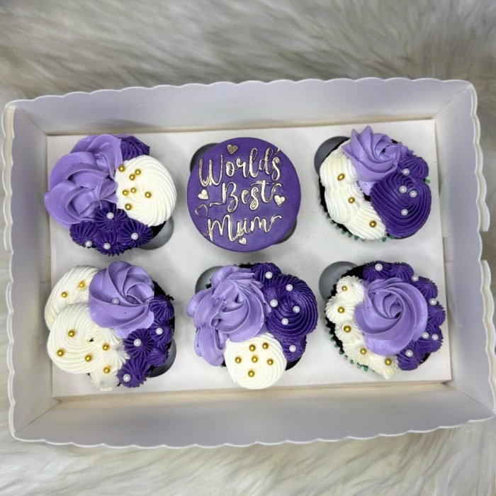 Beautiful Mother’s Day cupcakes with flower frosting and “Love You Mom” toppers in a gift box.