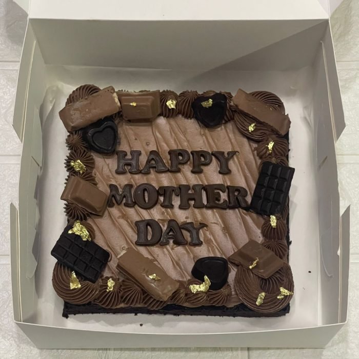 Mother’s Day brownie slab with “Love You Mom” message and decorative chocolate toppings in a gift box.