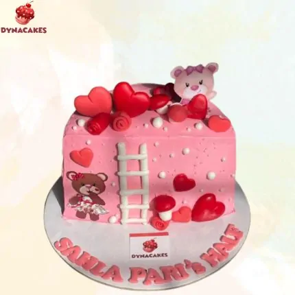 Teddy bear half birthday cake in pink and pastel shades for baby girl’s 6-month celebration.