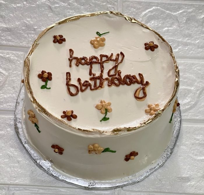 Cream floral birthday bento cake in Karachi