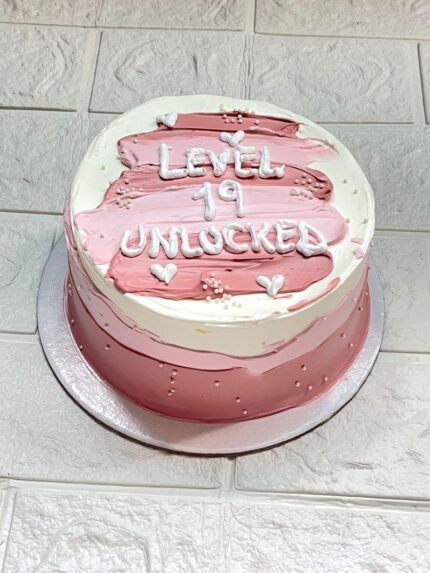 Level 19 Unlocked Pink Birthday Cake with white and pink cream design – DynaCakes Karachi