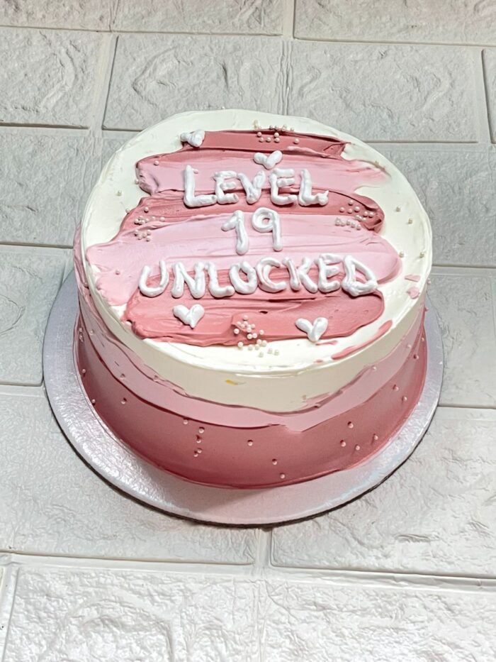 Level 19 Unlocked Pink Birthday Cake with white and pink cream design – DynaCakes Karachi