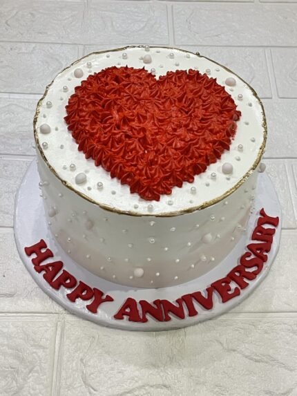 White Anniversary Cake with Red Heart