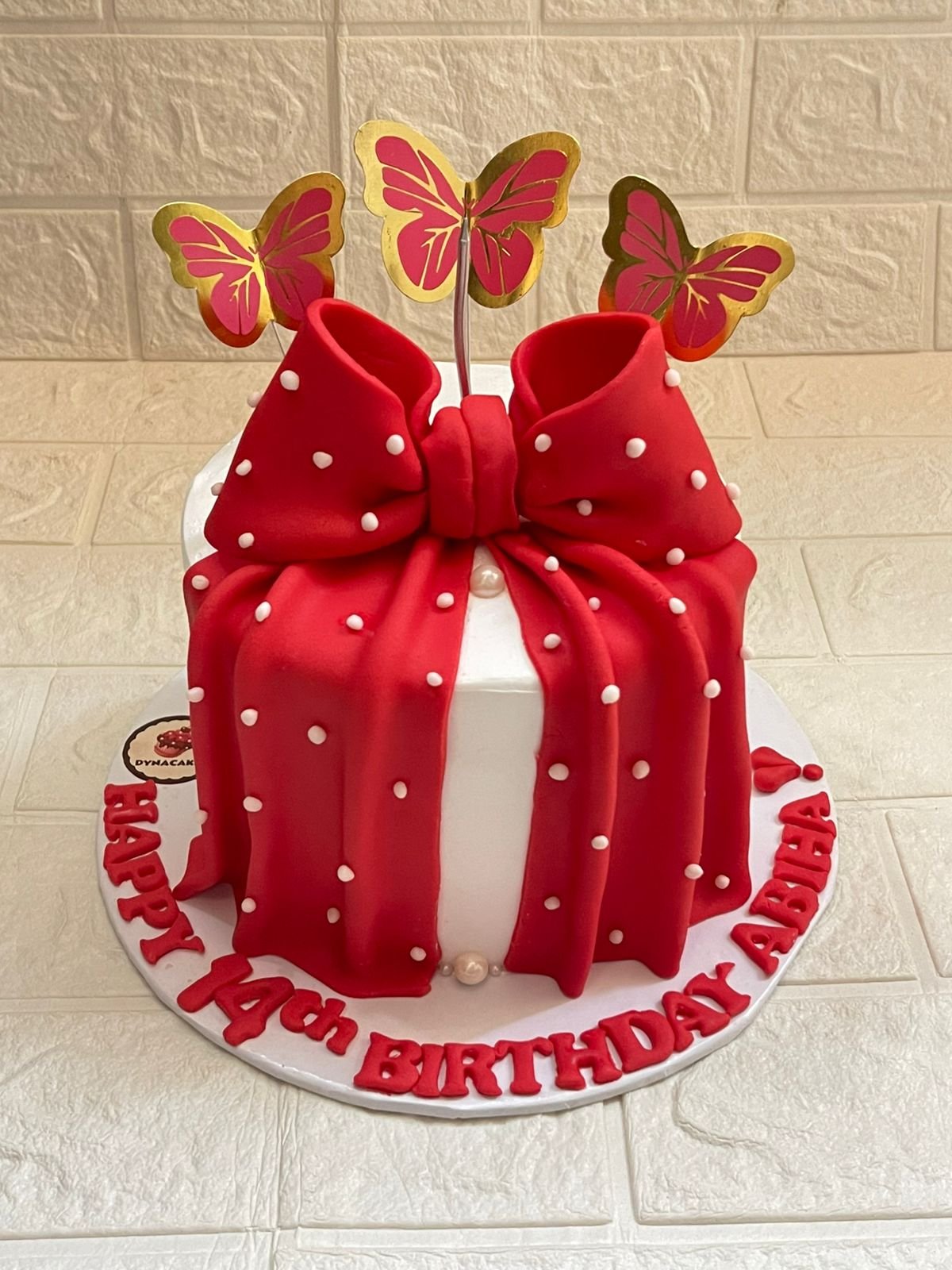 Stunning Red Bow Gift Box Birthday Cake for Girls with Butterfly Toppers in Karachi
